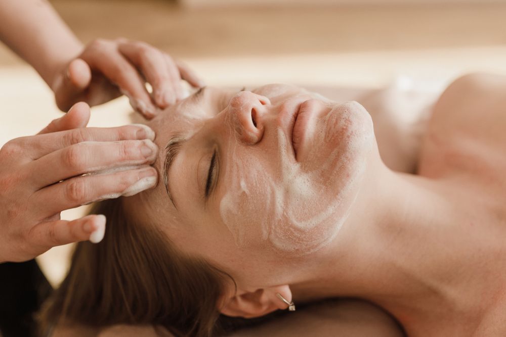 A facial massage being performed